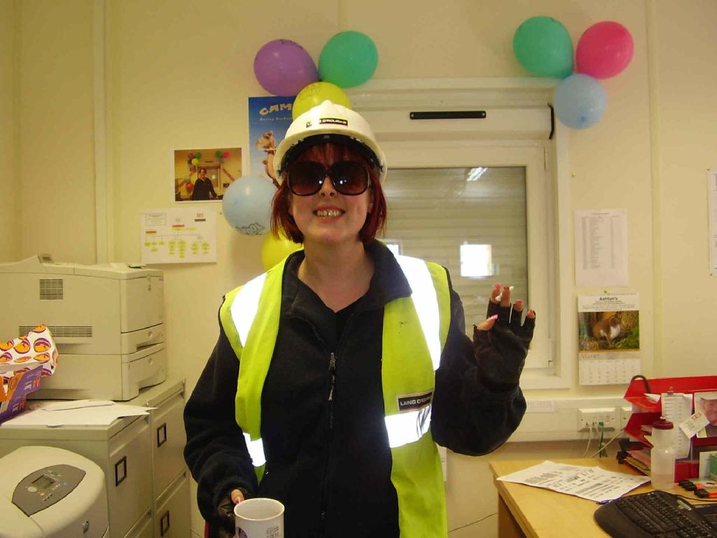 Fred proving you can work construction with inch-long pink fingernails